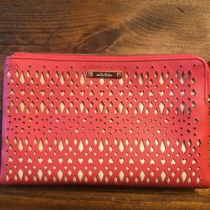 Stella and Dot tangerine color clutch. Never used.